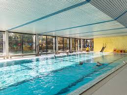 A swimming pool, swimming bath, wading pool, paddling pool, or simply pool is a structure designed to hold water to enable swimming or other leisure activities. Hallenbad Waldenbuch Indoor Swimming Pool