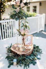 Arrange different colors and shapes on the table for an impressive and stunning atmosphere. 18 Chic Rustic Wedding Centerpieces With Tree Stumps Emmalovesweddings