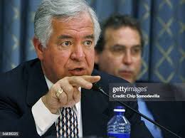 Wanda Blevins sits next to a photograph of herself and her husband,... News  Photo