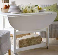 Build A Drop Leaf Round Storage Table Diy Furniture Plans Diy Dining Table Diy Kitchen Table