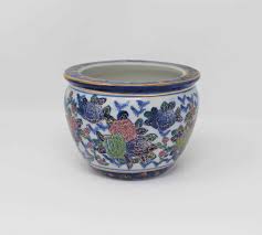 Inside the fishbowl are decorative swimming koi fish. Planter Fish Bowl New England Pottery Ming Dynasty Collection Blue Pink Floral Gold Edging Sold Antigo Trunk