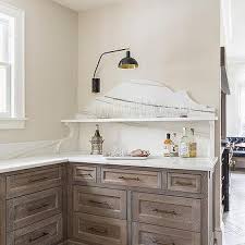 limed oak cabinets with white marble
