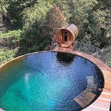 La Vue Au Bord Du Precipice Fait Rever In 2021 Swimming Pools Backyard Round Pool Backyard Pool Designs