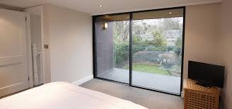 Juliet Balconies Minimal Windows By Iq Glass Slim Framed Sliding Doors Minimal Windows Exterior Doors With Glass
