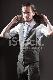 In fact, it makes you look as if you've got a short hairstyle. Young Man Long Hair Expressive Face Wearing Suit And Stock Photos Freeimages Com