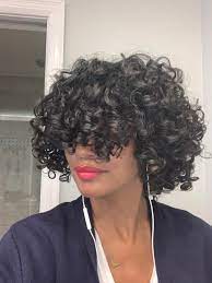 Long curly hair with bangs is somewhat controversial. Cutting Curly Bangs Genius Growing Out Curly Bangs Blinding Curlyhair