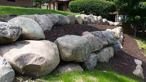 Another method of using natural dry stone as retaining walls results in the use of boulders to hold back ground. Boulder Retaining Wall Landscaping Retaining Walls Rock Wall Landscape Boulder Retaining Wall