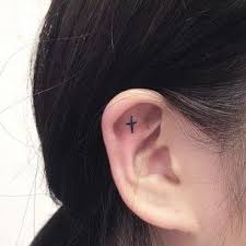 A Tiny Cross Inner Ear Tattoo Tattoos Trendy Tattoos