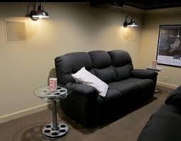 This warm and sophisticated theater room began as a design challenge. Barn Wall Sconces Add Dramatic Glow To Family S Home Theater Inspiration Barn Light Electric
