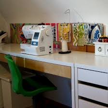 Accent wallpaper sets this crafts desk apart from the rest of the room, while sewing room storage, such as shelves and containers, keeps the clutter under control. Colorful Craft And Sewing Room Dwellinggawker