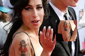 Drew barrymore's tattoos are unique in the fact that none of them use colored ink. Drew Barrymore Tattoos Amy Winehouse Winehouse Amy