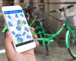 Image of person renting a bike through a sharing economy app