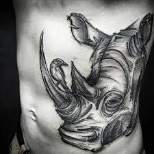 28 Creative Rhino Tattoo Designs And Ideas Tattoobloq Rhino Tattoo Tattoos Sketch Style Tattoos