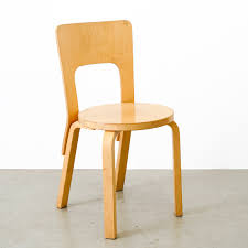 The functional birch wood stool impresses with its simple shape and for all through the special curvature of the legs, a design feature which is a central component of all alvar aalto furniture. Model 66 Stool By Alvar Aalto For Artek Finland 87137