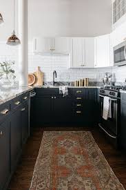Maybe you would like to learn more about one of these? Black And White Kitchen Cabinets With Polished Brass Cup Pulls Transitional Kitchen