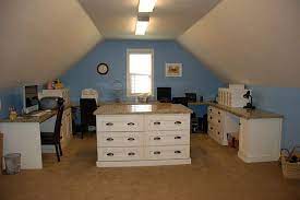 An attic craft room that forced me to get creative with storage solutions in such a small space. Tatertots And Jello Great Ideas Decorating Solutions 2 Craft Room Lighting Craft Room Desk Attic Spaces