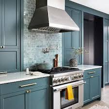 This kitchen might be small, but it makes a big statement. Teal Kitchen Cabinets Design Ideas