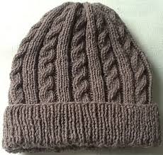 A knitting pattern for a baby hat with flower. Ravelry Marianna S Cabled Hat Pattern By Marianna Mel Cabled Hat Pattern Mens Hat Knitting Pattern Beanie Knitting Patterns Free