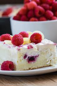 It really just hits the spot on any day when you want a little something sweet. White Chocolate Raspberry Poke Cake Recipe Queenslee Appetit