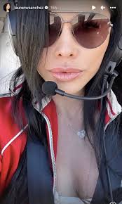 Lauren Sanchez shows off her press-on nails while flying