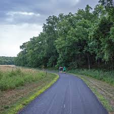 Olathe's Cedar Niles Park offers a 4-mile out-and-back that can begin at  one of three trailheads. The trail winds through rolling hills, forest and  prairie. There are also multiple bridged creek crossings.