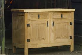 Heal's english modernism a sycamore cabinet, two door cupboard with shelved interior, four graduated drawers, mahogany stepped handles, mahogany base and square section legs, by. English Oak Kitchen Cabinet With Linenfold Carving Cowgill Forge And Furniture Workshop