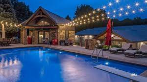 I personally think outdoor lights look so much better when they are draped in the middle and sort of slack down some. Outdoor Pool Lighting Design String Lights Around Pool Mckay Landscape Lighting Omaha Ne Youtube
