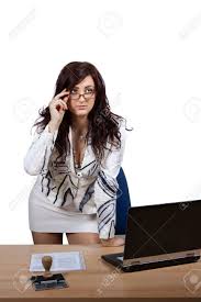 Young Female Office Worker Standing Behind A Desk With A Stern Look Stock Photo Picture And Royalty Free Image Image 25093188