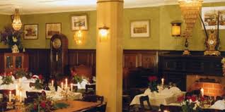 An abundance of crystal creates a brilliant sparkle via the column and finials while the polished nickel finish adds extra shine. Location Bar With Fancy Colonial Style Decoration In Munchen Altstadt Lehel