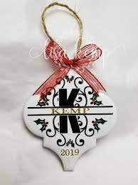 I used a hot glue gun to attach a ribbon and then cover the backs of the tile in the felt i had cut out. Christmas Holly And Berries Name Ceramic Lantern Tile Ornament Etsy In 2021 Vinyl Christmas Ornaments Unique Christmas Ornaments Christmas Ornament Crafts