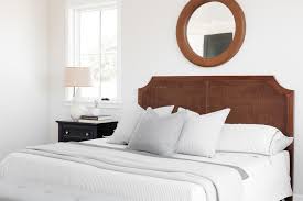 Give your bedroom the relaxed, breezy look of coastal decorating. Rattan Cane Headboard In Master Bedroom With Round Leather Mirror Farmhouse Bedroom Los Angeles By Madison Modern Home Houzz