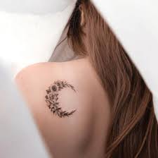A very delicate fine line crescent moon tattoo for the feminine, a heavy black ink tribal sun tattoo for the masculine, the crescent tattoo delicately balanced against the simple sun as a tattoo engraved in the what do sun tattoos mean? The Coolest Crescent Moon Tattoos And What They Mean