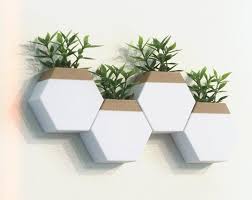 Featuring a subtle marbled finish and a modern trough tapered design, the planter is ideal as a room separation piece or lined along a patio railing. Modern Wall Planter Set Indoor Geometric Planters For Your Wall Garden Wall Planters Indoor Wall Planter Geometric Planter