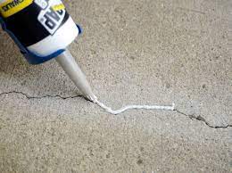 Mix vinyl concrete patching compound with water in a bucket, according to the directions on the package. How To Fill Small Cracks In Concrete Dummies
