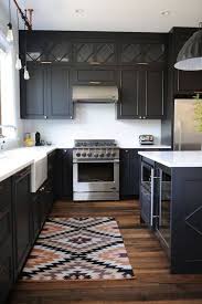 10 Beautiful Black Kitchens That Make Us Swoon In 2020 Spanish Style Kitchen Black Kitchens Black Kitchen Cabinets