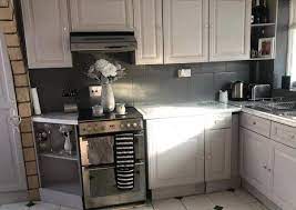 This paint comes with a clear liquid sachet (bonding chemical) that you i'm looking forward to painting the cupboards using the same brand paint. Dad Transforms His Kitchen For Just 50 Using B Q Tile Paint And Marble Effect Worktop Stickers