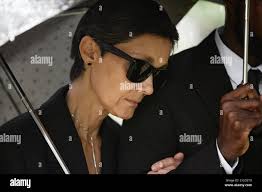 With her family at the funeral of her husband hi-res stock photography and  images