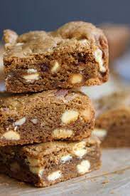 Nyt Cooking These Moist And Chewy Treats Couldn T Be Easier To Toss Together And Are Loaded With White Chocolate Chips H Baking Dessert Bars Treats