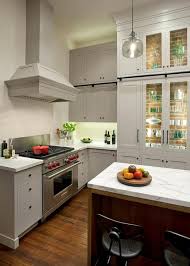 Tempered glass can be used for shelves in display cases or as shelving on wall systems. Lit Kitchen Cabinets With Glass Shelves Transitional Kitchen