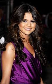 The curls will help to frame your face and neck area. Highlights For Dark Hair Selena Gomez Hair Hair Styles Curly Hair Styles