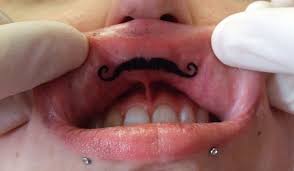 A skull tattoo doesn't have to use a human skull design. Lip Tattoos 40 Breathtaking Collections Design Press