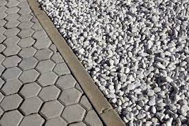 One easy, diy way to help prevent the spread of gravel is to tamp and pack it a bit. Keep Annoying Gravel Spillage Off Your Driveway Stone Set Diy Kit Stone Set Diy Kit