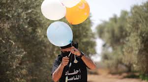 Palestinian terrorists in gaza preparing incendiary & explosive. Incendiary Balloons From Gaza Ignite Fires In Southern Israel Jewish Telegraphic Agency