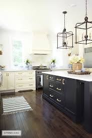 New Brass Hardware Pulls And Faucet Citrineliving Black Kitchen Island Kitchen Renovation New Kitchen Cabinets
