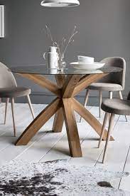 Meticulously crafted from solid oak wood and incredibly versatile, an extending dining table set will look charming in your home. Buy Oak Glass Round Dining Table From The Mnje Online Shop