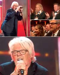 Nobody saw it coming. One minute, the Eagles were playing under the  stars—then boom, Bob Seger walked out. The crowd lost it. Cheers turned  into a roar as he tore into “Heartache