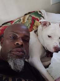 Dog using dad as pillow