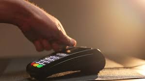 Making a purchase at pos offline. Close Up Hands Of Man Making Payment With Credit Card Machine Terminal While Swiping Debit Card By Uflypro