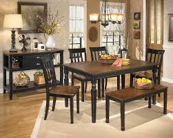 Rich wooden tables and chairs are a smart choice to liven up black and gray dining rooms, but there are plenty of options to suit any taste. Owingsville Black Brown Dining Room Set Speedyfurniture Com