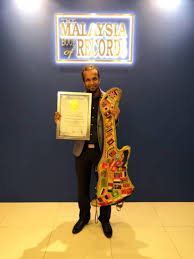 So what was this feat about? Guitar Strumming Globetrotter Gets Into Malaysia Book Of Records Nestia